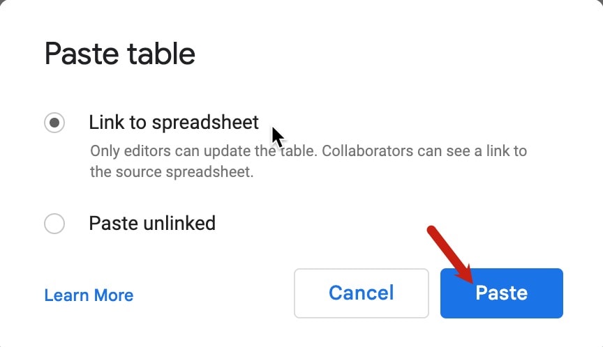 A red arrow pointing at the paste button.